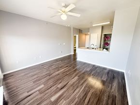 San Antonio apartment for rent - A room with wooden flooring and a ceiling fan.