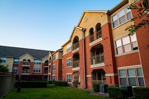 San Antonio apartment for rent - A large apartment complex with red and yellow buildings.