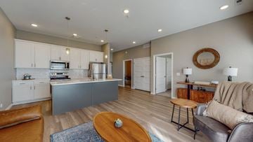 Rochester apartment for rent - a living room with a kitchen and a table