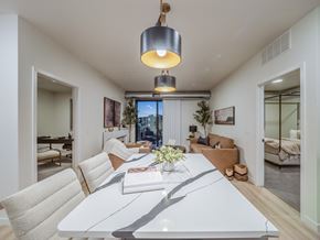 Casper apartment for rent - A modern dining room with a white table and chairs.