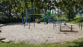 Ingersoll townhouse for rent - a playground in a park with a picnic table