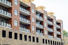 Cambridge apartment for rent - A multi-story building with balconies and windows.