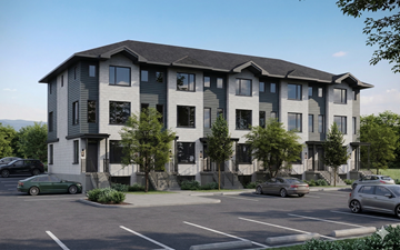 Guelph townhouse for rent - A modern building with a parking lot in front.
