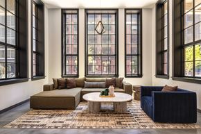 Jersey City apartment for rent - Common area with seating, large windows.