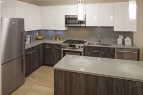 Stamford apartment for rent - a kitchen with stainless steel appliances and white counter tops
