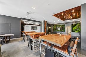 Jersey City apartment for rent - resident amenity, large maker style tables