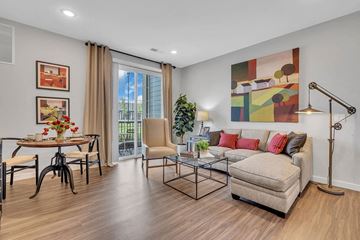 Belle Mead apartment for rent - A living room with a couch, chairs, and a painting on the wall.