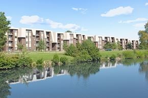 Newark apartment for rent - A row of apartment buildings are reflected in the water.