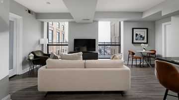 Philadelphia apartment for rent - A living room with a white couch and a television.