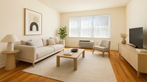 Bayonne apartment for rent - Modern Bayonne apartment living room with natural light, hardwood floors, and clean neutral finishes