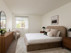 Plainsboro apartment for rent - A bedroom with a large bed and a window with blinds.