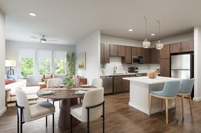 Kissimmee apartment for rent - A modern kitchen with a dining table set for four.