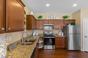 Burlington apartment for rent - a kitchen with stainless steel appliances and a granite counter top