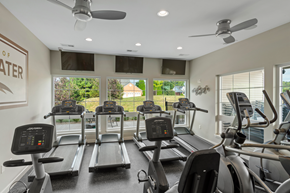 Harrison apartment for rent - A gym with treadmills and a wall sign that says