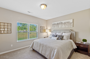 Harrison apartment for rent - a bedroom with a large bed and a window