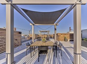 Rahway apartment for rent - Rooftop terrace at The Mint Rahway with dining and lounging areas, offering stunning views, close to Rahway Train Station and Union County Performing Arts Center.