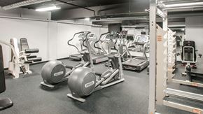 Philadelphia apartment for rent - Cardio equipment and weight training machines inside The Pepper Building's fitness center, a premier apartment complex near Fitler Square, Philadelphia.