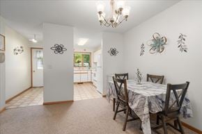 Scandia apartment for rent - A dining room with a table set for four.