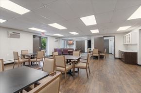 Forest Lake apartment for rent - A conference room with a long table and chairs.