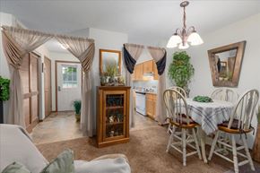 Forest Lake apartment for rent - A dining room with a table set for four.