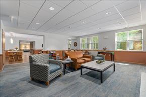 Woodbury apartment for rent - A spacious waiting room with comfortable seating and a coffee table.