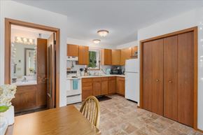 Stillwater townhouse for rent - A kitchen with wooden cabinets and a tiled floor.