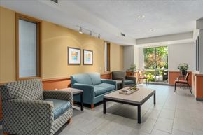Woodbury apartment for rent - A living room with a sofa, armchairs, and a coffee table.