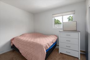 St. Paul Park apartment for rent - A bedroom with a bed, dresser, and window.