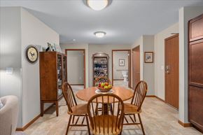Mahtomedi apartment for rent - A dining room with a wooden table and chairs.