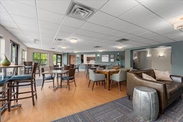 Mahtomedi apartment for rent - A living room with a dining table and chairs.