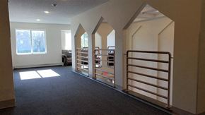 Cottage Grove townhouse for rent - an empty room with a staircase and a book shelf