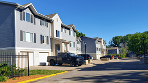 Cottage Grove townhouse for rent - a truck parked in front of a row of houses