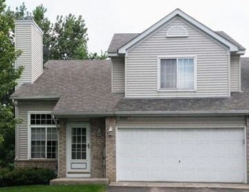 Oakdale townhouse for rent - a white house with a white garage door