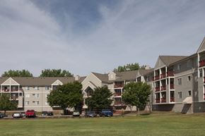Oakdale apartment for rent - a row of apartment buildings on the side of a grass field