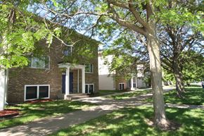 St. Paul Park apartment for rent - a brick building with trees in front of it