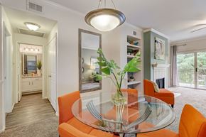 New Braunfels apartment for rent - a dining room with orange chairs and a glass table