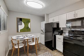 Hurst apartment for rent - a kitchen and dining area in a 555 waverly unit