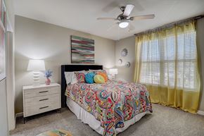 Allen apartment for rent - a bedroom with a bed and a ceiling fan