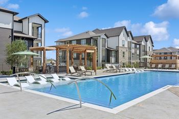 Expansive resort style pools with loungers