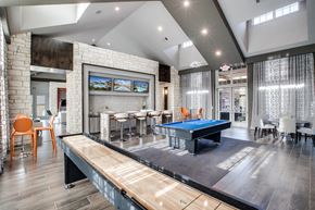 Conroe apartment for rent - a game room with a pool table and a ping pong table