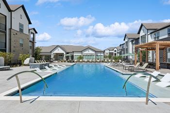 Expansive resort style pools with loungers