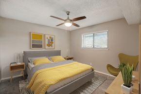 Hurst apartment for rent - a bedroom with a bed and a ceiling fan