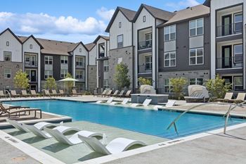 Expansive resort style pools with loungers