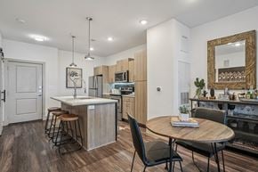San Antonio apartment for rent - A modern kitchen with a dining table and chairs.