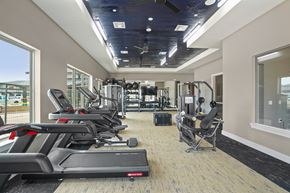 Katy apartment for rent - A gym with treadmills, weights, and exercise equipment.