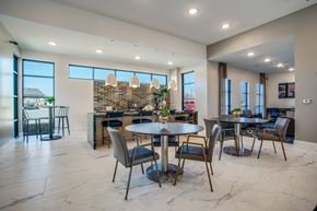 Burleson apartment for rent - Community dining area with café tables, chairs, and adjacent serving counter.
