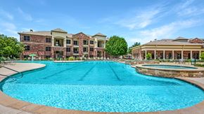 Lewisville apartment for rent - A large swimming pool in front of a building.