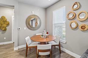 Waxahachie apartment for rent - A dining room with a round table and chairs.