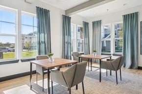 Farmersville apartment for rent - A dining room with a table and chairs.