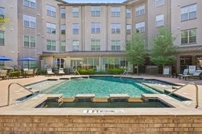 Garland apartment for rent - A large swimming pool in front of a building with a sign that says "No Diving".